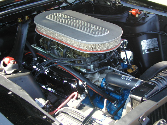 1967 Ford Ranchero engine bay with chrome air cleaner and blue valve covers