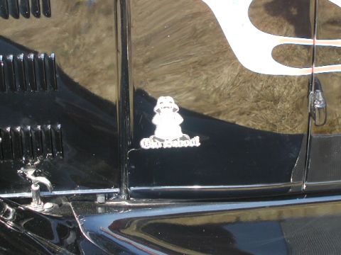 1967 Ford Ranchero - A black vehicle's side panel displays flames and an 'Old School' sticker, with visible vents and trim.