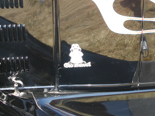 Black vehicle side panel with flames and an 'Old School' sticker