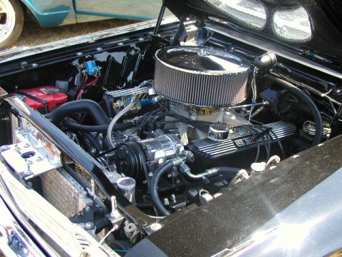 1967 Ford Ranchero - Detailed view of a V8 engine bay, a chrome air cleaner and custom components.
