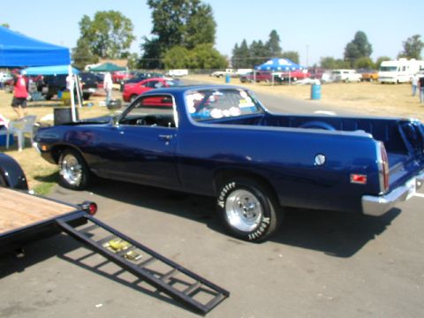 1967 Ford Ranchero - A blue 1970 Ford Ranchero pickup truck is seen from the side at an outdoor event.