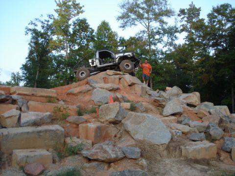 1974 Ford Bronco - Custom off-road truck navigates a challenging rock crawling course.