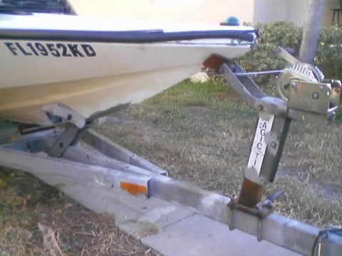 1989 Ford Bronco - A boat with registration FL1952KD is seen on a trailer.