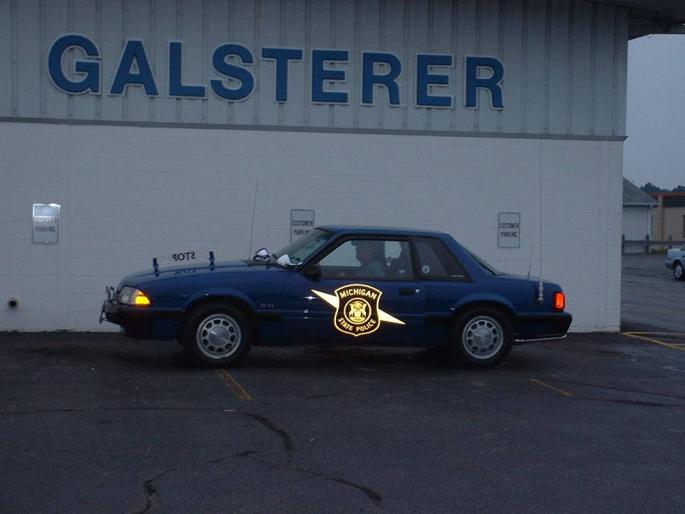 Blue Michigan State Police car, side view, 1987 model year
