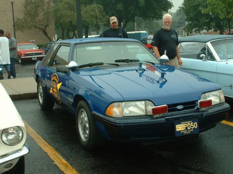 1978 Ford Mustang II - Michigan State Police car with "PD50" license plate, seen at an outdoor event.