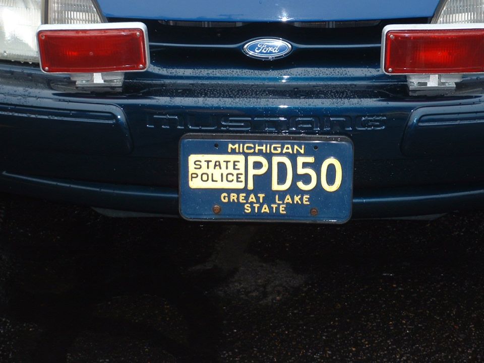 Ford police car front with Michigan State Police license plate PD50