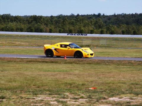 2001 Mercury Grand Marquis - A yellow Lotus Elise is seen on the Pocono race track.