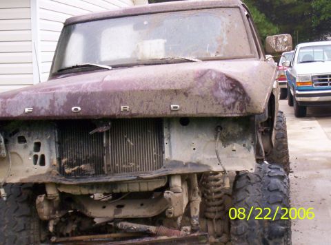 1978 Ford F-150 - A heavily soiled Ford truck, likely from the mid-1970s, sits in front of another vehicle.