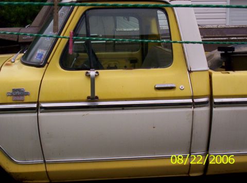 1978 Ford F-150 - Side view of a 1978 Ford F-150 Ranger pickup truck with yellow and white paint.