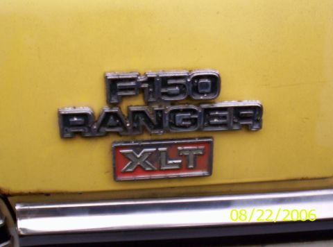 1978 Ford F-150 - The F-150 Ranger XLT badge is visible on the yellow body of the truck.