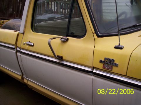 1978 Ford F-150 - A yellow and white 1978 Ford F-150 Ranger XLT is shown from the side, with visible badging and a date stamp.