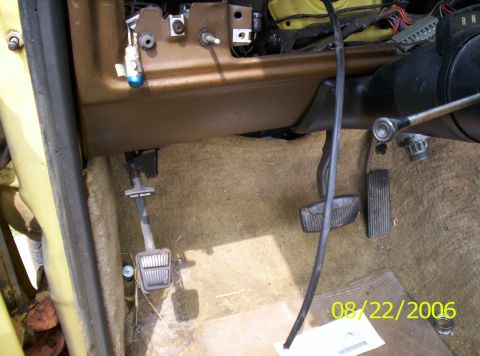 1978 Ford F-150 - Interior view of a 1978 Ford F-150 showing the footwell, pedals, and dashboard wiring.