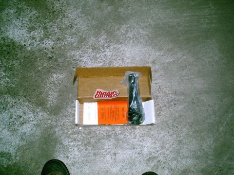2001 Dodge 2500 - A Rough Country steering stabilizer is shown in its opened box, alongside installation instructions.