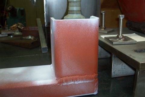1983 Ford Bronco - A metal bracket, likely a crossmember, is shown with fresh paint and visible welds.