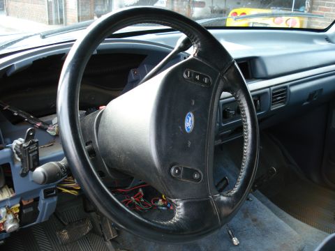 1994 Ford Bronco - Interior view of a 1994 Ford Bronco, focusing on the steering wheel and dashboard area.
