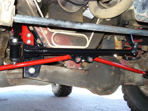 1994 Ford Bronco - Aftermarket suspension components are visible on the underside of a vehicle, with a "SUPERMOTORS.NET" watermark.