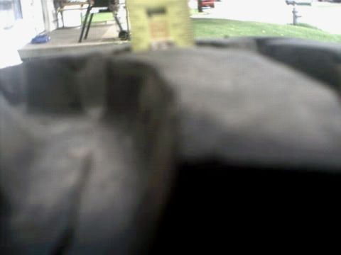 1996 Ford Bronco - The image shows a close-up of a tire's tread pattern with a website logo in the lower right corner.