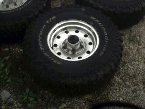 1996 Ford Bronco - Set of BFGoodrich All-Terrain T/A tires mounted on alloy wheels, suitable for off-road use.