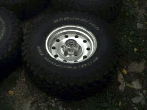 1996 Ford Bronco - BFGoodrich Mud-Terrain T/A tire and chrome wheel shown up close.