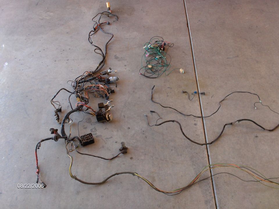 There's the old factory Ford Fairlane wiring harness. With it out, it doesn't look like there's much to it. By the way, that bundle with green wires and little black box were for the aftermarket stereo and tachometer, not factory.