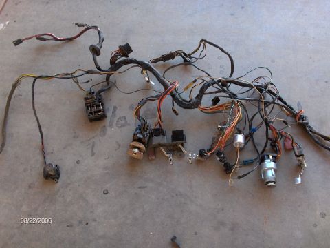 1966 Ford Fairlane - This is a complex automotive wiring harness, likely from an older vehicle, spread out on a concrete surface.