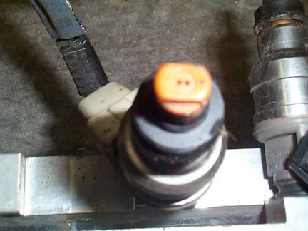 1992 Ford Wagon - Closeup of a fuel injector.