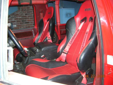 1985 Ford Bronco - The interior features red and black Corbeau racing seats with red harnesses, dated August 22, 2006.