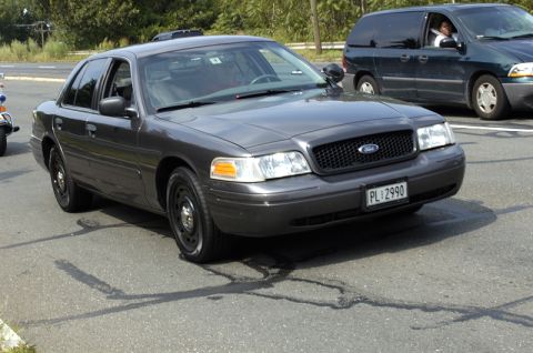 1978 Dodge Monaco - A dark gray Ford Crown Victoria is seen from the front-right, with another vehicle in the background.