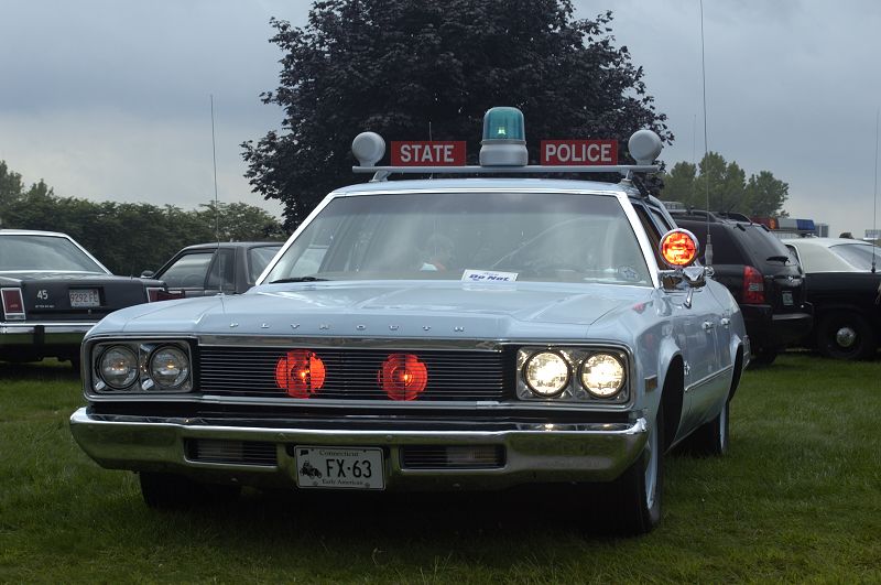 Light blue 1970s Plymouth state police cruiser with STATE POLICE roof lightbar at car show