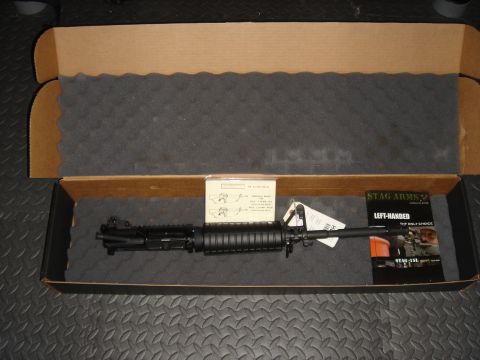 1990 Ford Bronco - A Stag Arms AR-15 upper receiver is shown in its original packaging with instructional materials.