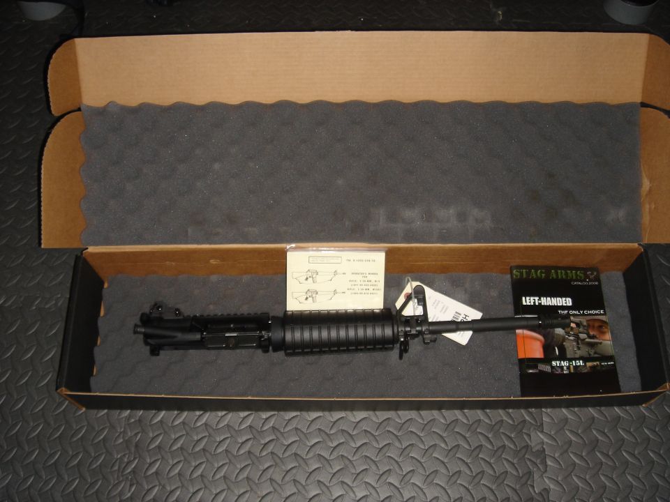 AR-15 upper receiver in a box with instructions and Stag Arms pamphlet