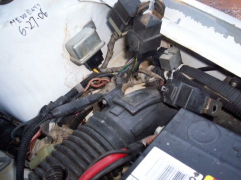 1990 Dodge Shadow - Close-up of engine bay wiring and components, with handwritten note 'NEW BATT 6-27-06'.