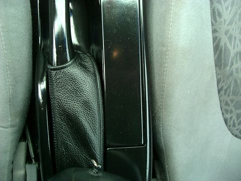 1995 Ford Probe - Close-up of the interior center console and parking brake lever.
