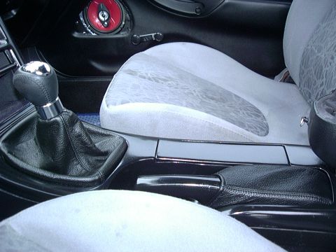 1995 Ford Probe - Close-up of a car's interior, focusing on the center console and seating area, with a visible watermark.
