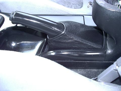 1995 Ford Probe - Interior view of a vehicle's center console and parking brake lever.