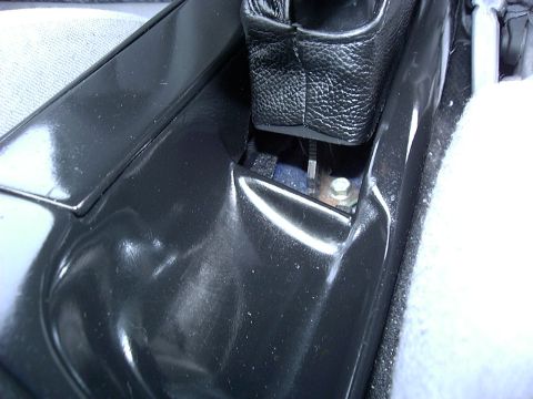 1995 Ford Probe - Detail shot of the interior center console area, focusing on trim and shifter components.