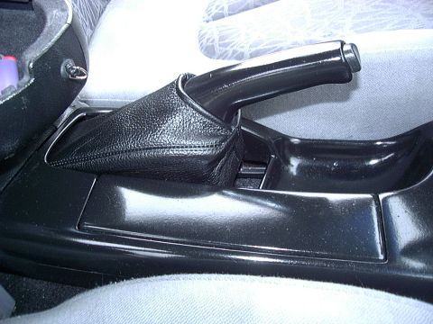1995 Ford Probe - Close-up of a car's interior handbrake assembly.