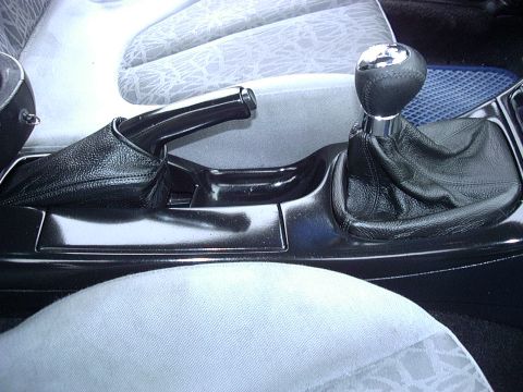 1995 Ford Probe - Close-up of the interior center console, showing the gear shifter and handbrake. The Supermotors.net logo is visible in the lower right cor…