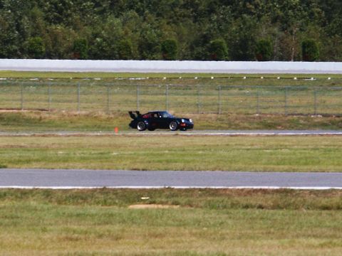 2001 Mercury Grand Marquis - A black Porsche 911 Turbo is seen on a race track during an event.