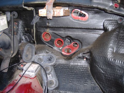 1998 Ford Taurus - The interior of a car has been disassembled, revealing insulation and various components of the heating and cooling system.