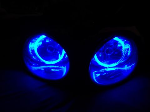 1998 Ford Taurus - Headlights with blue halo rings are visible in the dark.