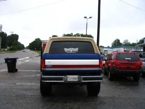 1989 Ford Bronco - This Ford Bronco has a distinctive red, white, and blue stripe across its tailgate.
