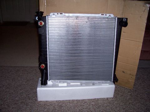1989 Ford Bronco II - A new radiator is shown resting on its protective foam packaging, ready for installation.