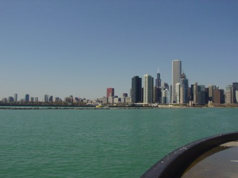 1998 Ford Mustang - View of the Chicago skyline from the water, with a boat's railing visible in the foreground.