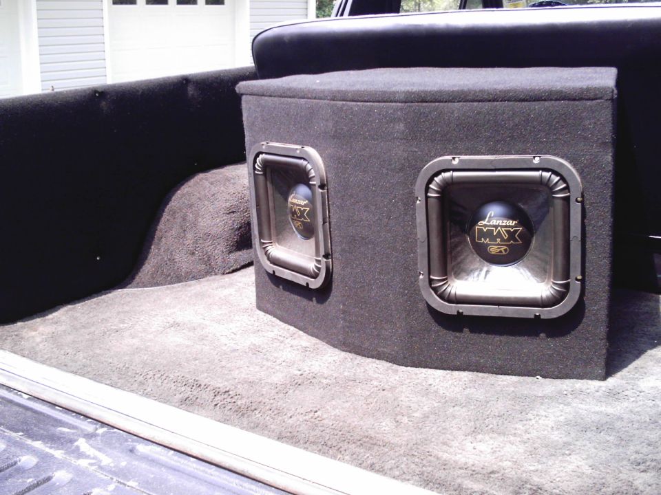 $100, 2- 800w lanzar subs mounted in custom box w/ amp resessed in the back.
hits hard with the box being so big.
couldn't afford kickers. 
still can't.