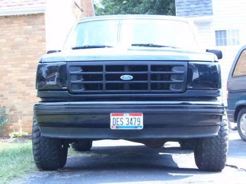 1993 Ford Bronco - Front view of a black 1993 Ford Bronco, its distinctive grille and license plate.