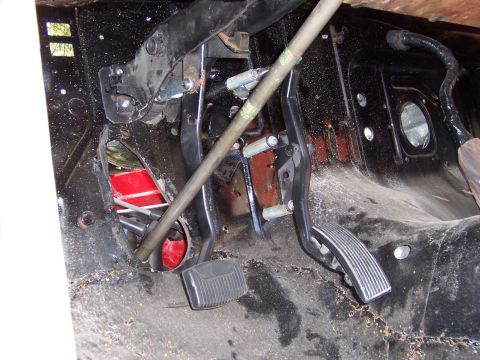 1964 Mercury Comet - Interior view of a car's firewall showing the pedal assembly and surrounding metalwork.