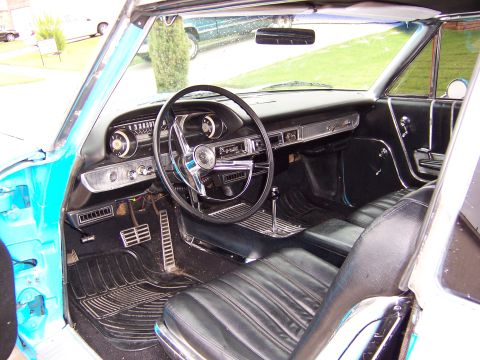 1963 Ford Galaxie - Interior view of a 1963 Ford Galaxie, showing the dashboard, steering wheel, and seating.
