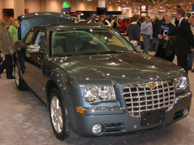 Gray Chrysler 300 sedan front 3/4 view at an auto show