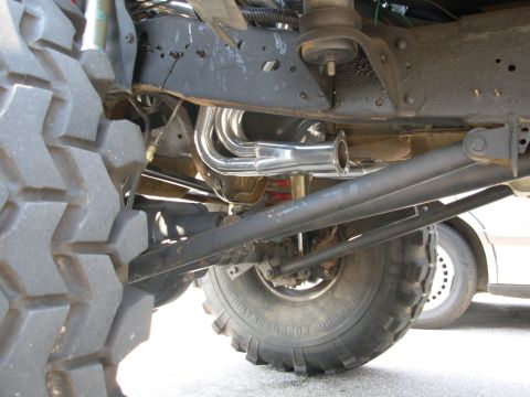 1994 Ford Bronco - The image shows exhaust headers and suspension components, not a 1994 Ford Bronco.